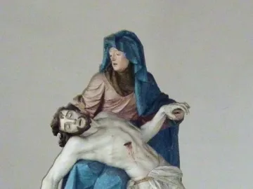 Nenningen Pietà showing a polychrome sculpture of Mary cradling the body of Christ across her lap