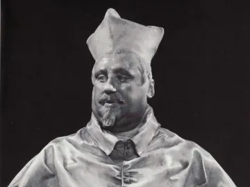 Marble bust of Cardinal Scipione Borghese wearing a clerical cap and buttoned robes.