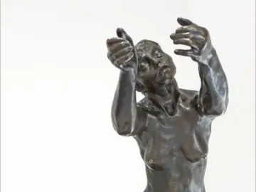 The Implorer bronze sculpture shows a kneeling nude figure with head tilted upward and both arms raised in supplication.