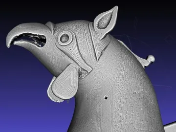 Grayscale 3D scan of the Pisa Griffin showing the head and upper body with an open beak, pointed ears, and textured detailing.