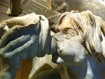 Detail of Bernini\'s Neptune and Triton showing Triton in profile blowing a shell.