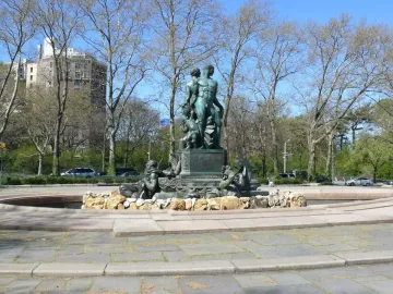 Bailey Fountain sculpture in a circular stone basin in a Brooklyn plaza