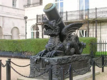 Cádiz Memorial sculpture of a winged dragon-like creature supporting a cannon barrel