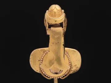Serpent labret with articulated tongue shown from above on a black background.