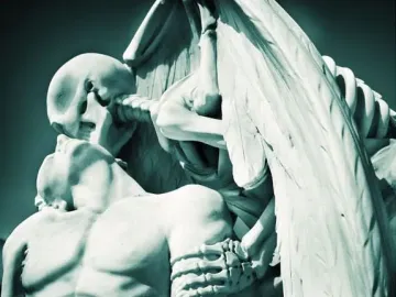 The Kiss of Death sculpture showing a skeletal figure leaning over a bare-chested man with its face pressed to his forehead.