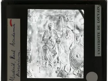 Monochrome slide of the Disc of Theodosius showing an enthroned figure holding an orb, flanked by two armed figures.