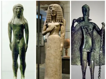 Three ancient statuettes: a nude green-patinated male figure, a robed figure with an elaborate wig, and a cloaked figure holding a staff.