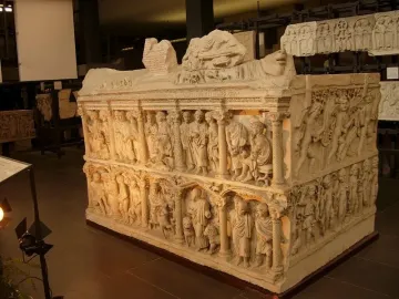 The Sarcophagus of Junius Bassus with two tiers of carved figures in arched architectural panels.