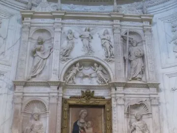Piccolomini Altarpiece with a central painting of the Virgin Mary and Child, flanked by large marble statues and ornate sculpted panels.