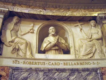 Marble relief monument of Cardinal Roberto Bellarmine in an arched niche, flanked by seated female figures holding a chalice, book, and crucifix.