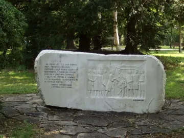 Keys Handover Memorial stone block with Cyrillic inscription and relief of figures exchanging keys