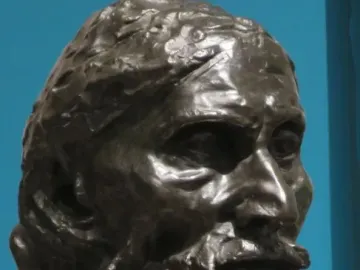 Bust of Eustache de Saint Pierre showing an elderly man with a textured beard, furrowed brow, and solemn expression.