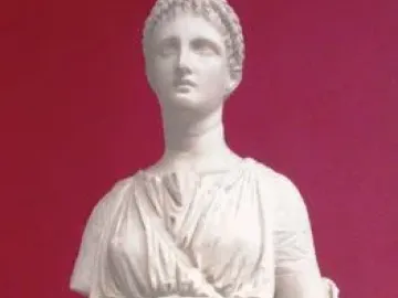 Artemis Diadoumena marble statue of a standing female figure with draped robes, braided hair, and a missing right arm below the shoulder.