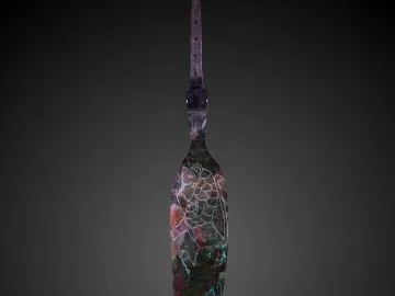 Spear of Lugal with a leaf-shaped metal blade, engraved animal motif, and perforated tang on a dark background.