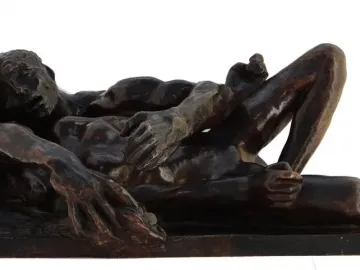 Avarice and Lust by Auguste Rodin, showing two intertwined figures on a rectangular base.
