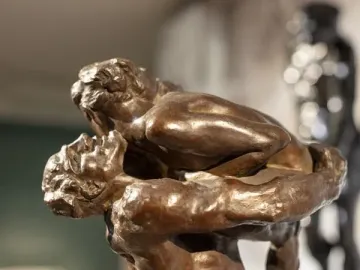 Close-up of the bronze sculpture I Am Beautiful showing two intertwined figures.