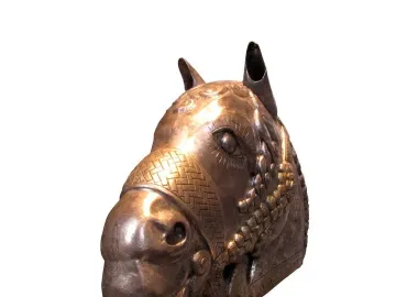 Sassanian horse head sculpture with ornate facial details and upright ears on a white background.