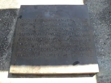 Engraved metal plaque with a five-pointed star at the Monument to the Revolution of the People of Moslavina in Podgarić.