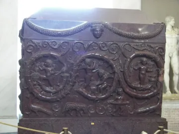 Sarcophagus of Constantina with carved reliefs of winged putti, foliage, garlands, and animal figures.