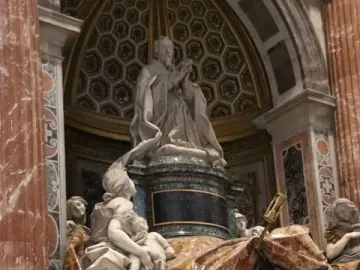 Tomb of Pope Alexander VII showing a kneeling figure above a flowing marble drapery and a skeletal figure with an hourglass and spear below, with white marble allegories at the base.