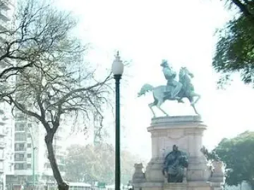 Monument to Giuseppe Garibaldi with a bronze equestrian statue on a stone pedestal in a park