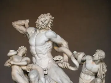 Laocoön and His Sons marble sculpture showing three figures entwined by serpents.
