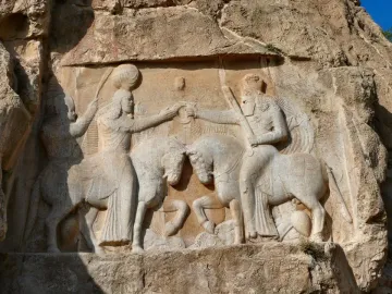 Ardashir Investiture Relief carved into a cliff face, showing two mounted figures facing each other and exchanging a ring.