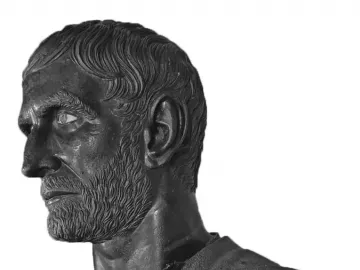 Capitoline Brutus bronze bust in left profile with wavy hair, beard, and an inlaid eye.