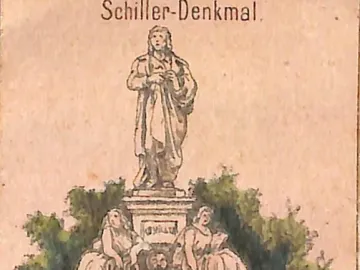 Schiller Monument with a standing figure on a pedestal, flanked by two seated allegorical figures behind an iron fence.