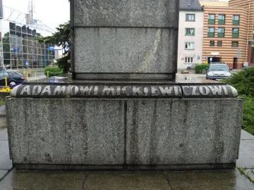 Granite pedestal of the Adam Mickiewicz monument with the inscription \