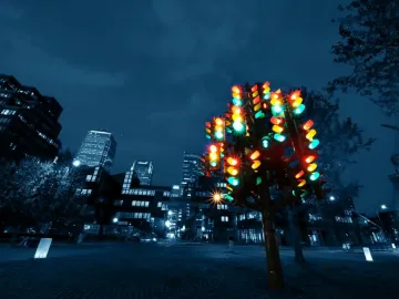 Traffic Light Tree sculpture glowing with red, green, and amber lights at night