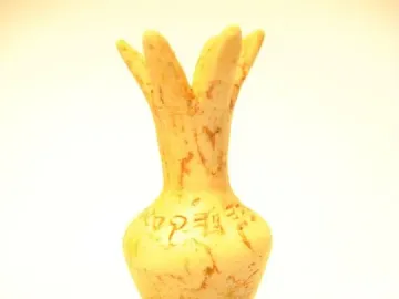 Ivory Pomegranate replica with a narrow neck, petal-like top, and faint ancient inscriptions on a rounded body.
