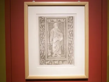 Framed monochrome print showing a bearded haloed figure surrounded by decorative panels and a narrative frieze from the Filarete Door.