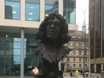 Betty Campbell statue in Cardiff, a bronze monument with a bust of a woman above children reading around the base.