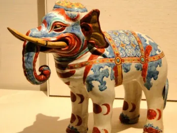 Kakiemon elephant porcelain figurine with blue and red floral patterns