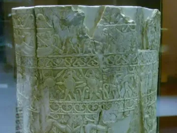 Carved ivory pyxis of the Situla of the Pania with friezes of figures, animals, and decorative motifs.