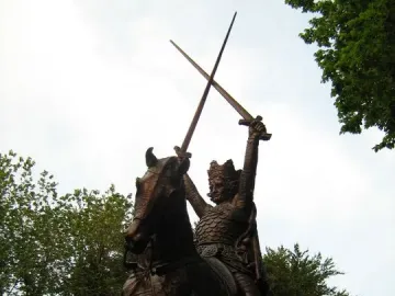 King Jagiello Monument, a bronze equestrian statue of a crowned figure holding two crossed swords aloft in Central Park.