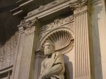Saint Paul marble statue standing in an ornate carved niche with fluted pilasters and a shell-shaped alcove.