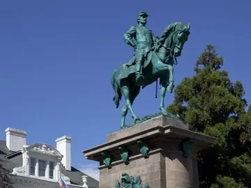 The equestrian bronze statue of Major General George B. McClellan on a tall stone pedestal, with military reliefs at the base.