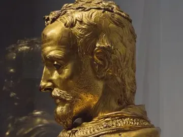 Saint Rossore Reliquary, gilded bronze bust of a bearded man in profile with curly hair and an ornate collar