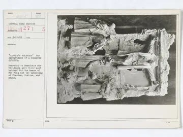 Archival photograph of a document card beside an angled relief sculpture from Canada\'s Golgotha, showing soldiers in a commemorative scene.