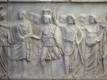 Cancelleria Reliefs showing a classical Roman procession carved in pale marble with robed figures and a helmeted woman among them.