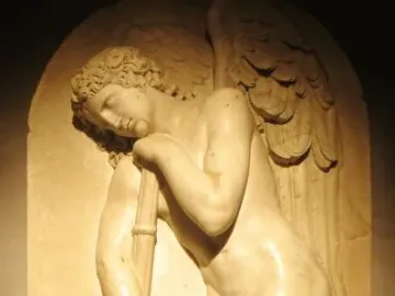 Marble bas-relief from the Monument to Elena Pavlovna showing a sorrowful winged figure leaning on an inverted torch.