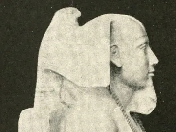 Right profile of the Khafre Enthroned statue, showing the pharaoh with a nemes headdress, false beard, and beaded necklace.