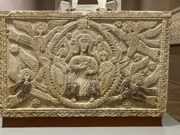 Rachis Altar relief with a robed haloed figure surrounded by winged haloed figures and an inscription along the top