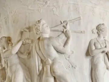 Borghese Vase relief with a satyr playing a double flute between two draped women