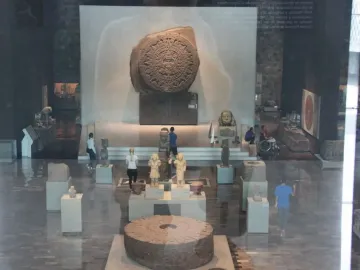 Stone of Motecuhzoma I circular carved monolith displayed in a museum hall