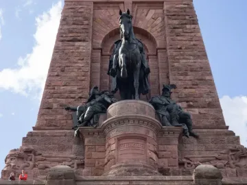 Kyffhäuser Monument with a large bronze equestrian statue in an arched alcove, flanked by seated bronze figures.