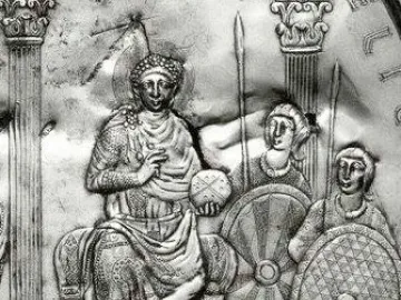 Relief from the Disc of Theodosius showing an enthroned ruler holding an orb, flanked by attendants and columns.