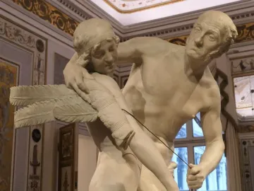 Daedalus and Icarus marble sculpture by Antonio Canova, showing an older man fitting wings onto a younger man.